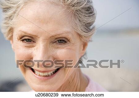 Portrait of a senior woman at the beach View Large Photo Image Stock Photo - Portrait of a senior woman at the beach . Fotosearch