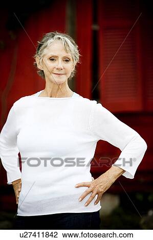 Portrait of a smiling senior woman View Large Photo Image Stock Image - Portrait of a smiling senior woman . Fotosearch