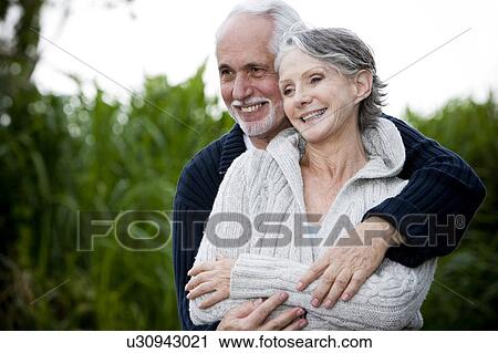 Senior couple smiling and embracing View Large Photo Image Stock Image - Senior couple smiling and embracing . Fotosearch