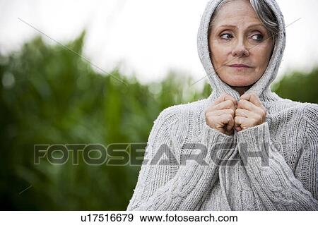 Stock Photo - Senior woman looking apprehensive . Fotosearch