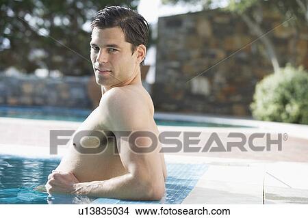 A man relaxing in a pool View Large Photo Image Picture - A man relaxing in a pool. Fotosearch