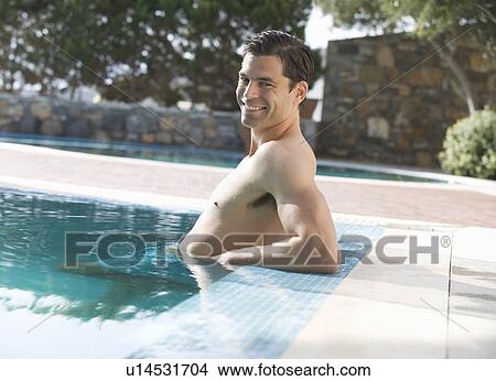 A man relaxing in a pool View Large Photo Image Picture - A man relaxing in a pool. Fotosearch