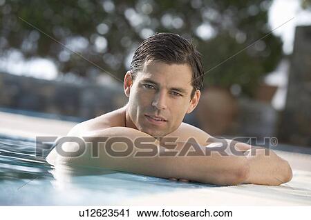A man relaxing in a pool View Large Photo Image Stock Image - A man relaxing in a pool. Fotosearch