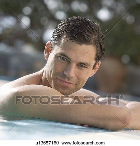 A man relaxing in a pool View Large Photo Image Stock Image - A man relaxing in a pool. Fotosearch