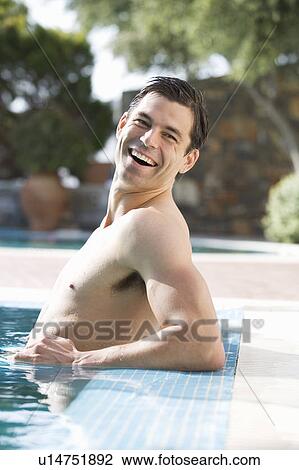 A man relaxing in a pool View Large Photo Image Stock Image - A man relaxing in a pool. Fotosearch