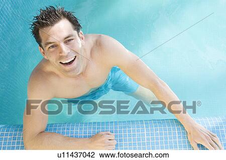 A man swimming in a pool View Large Photo Image Stock Image - A man swimming in a pool. Fotosearch