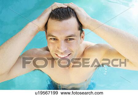 A man swimming in a pool View Large Photo Image Stock Photo - A man swimming in a pool. Fotosearch