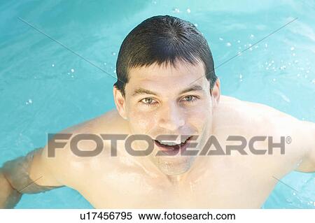 A man swimming in a pool View Large Photo Image Stock Photography - A man swimming in a pool. Fotosearch