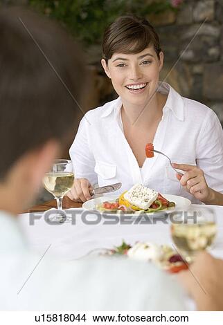A couple sharing a romantic meal View Large Photo Image Picture - A couple sharing a romantic meal. Fotosearch