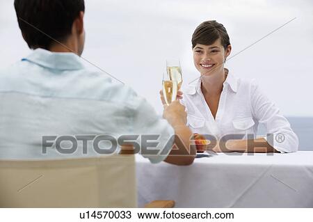 Stock Image - A couple sharing a romantic meal. Fotosearch