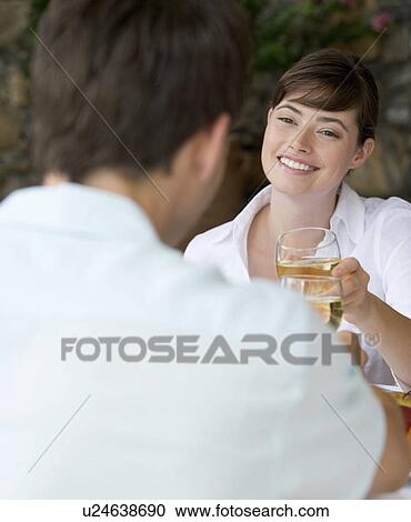 Stock Image - A couple sharing a romantic meal. Fotosearch