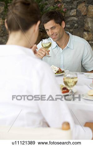 A couple sharing a romantic meal View Large Photo Image Stock Photo - A couple sharing a romantic meal. Fotosearch