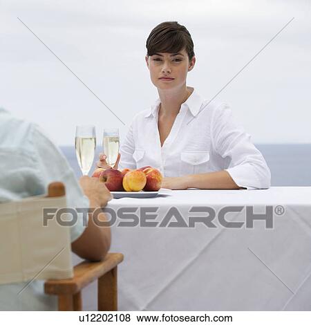 A couple sharing a romantic meal View Large Photo Image Stock Photo - A couple sharing a romantic meal. Fotosearch