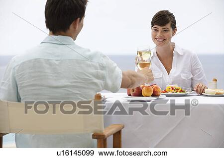 A couple sharing a romantic meal View Large Photo Image Stock Photo - A couple sharing a romantic meal. Fotosearch