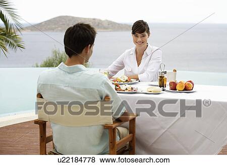 A couple sharing a romantic meal View Large Photo Image Stock Photo - A couple sharing a romantic meal. Fotosearch