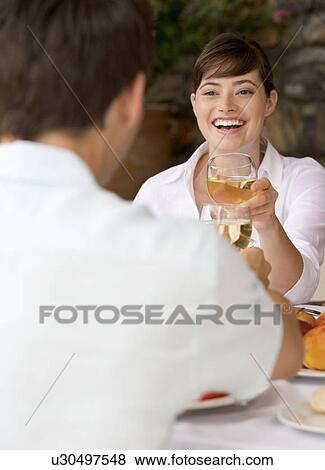 Stock Photo - A couple sharing a romantic meal. Fotosearch