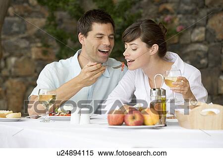 A couple sharing a romantic meal View Large Photo Image Stock Photography - A couple sharing a romantic meal. Fotosearch
