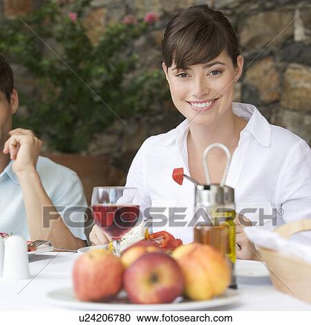 A woman enjoying a healthy meal View Large Photo Image Stock Image - A woman enjoying a healthy meal. Fotosearch