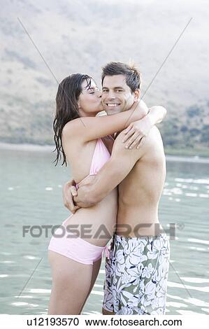 A couple embracing on holiday View Large Photo Image Stock Image - A couple embracing on holiday. Fotosearch