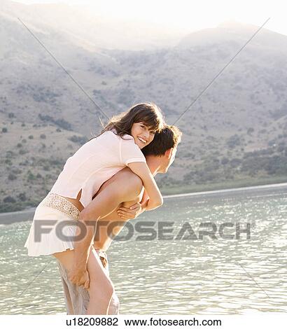 A couple having fun in a lake View Large Photo Image Stock Image - A couple having fun in a lake. Fotosearch