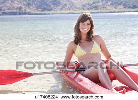 A woman in a kayak View Large Photo Image Picture - A woman in a kayak. Fotosearch