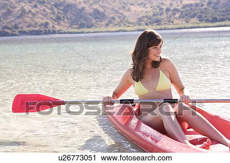 A woman in a kayak View Large Photo Image Stock Image - A woman in a kayak. Fotosearch