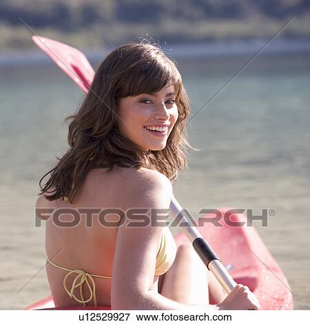 A woman in a kayak View Large Photo Image Stock Photo - A woman in a kayak. Fotosearch