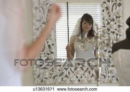 A bride getting ready for her wedding View Large Photo Image Stock Image - A bride getting ready for her wedding. Fotosearch