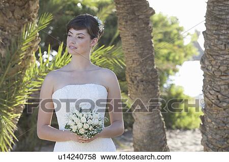 A bride holding her bouquet View Large Photo Image Stock Photo - A bride holding her bouquet. Fotosearch