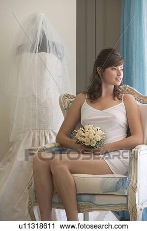 Stock Image - A bride sitting in a chair. Fotosearch