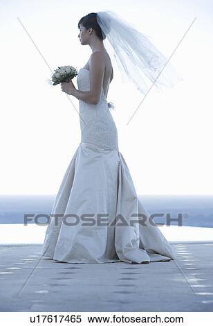 A bride waiting by a pool View Large Photo Image Stock Photography - A bride waiting by a pool. Fotosearch