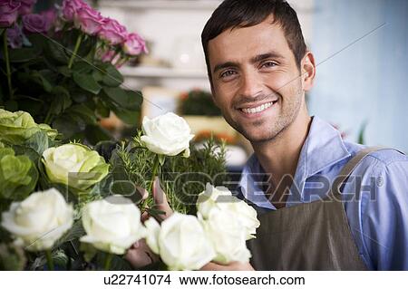 Male florist amongst the flowers in his shop View Large Photo Image Picture - Male florist amongst the flowers in his shop. Fotosearch