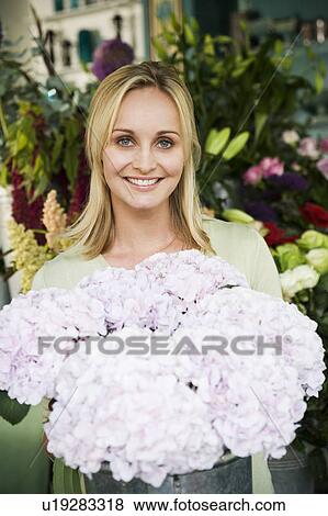 Woman in a florist's shop View Large Photo Image Stock Photo - Woman in a florist's shop. Fotosearch