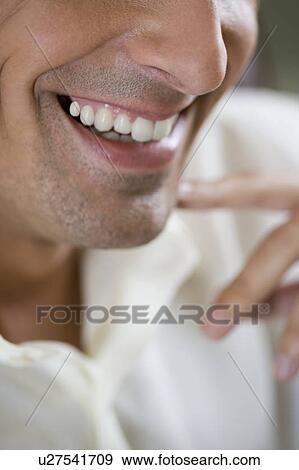 Close up of a young man's mouth smiling View Large Photo Image Stock Photo - Close up of a young man's mouth smiling. Fotosearch