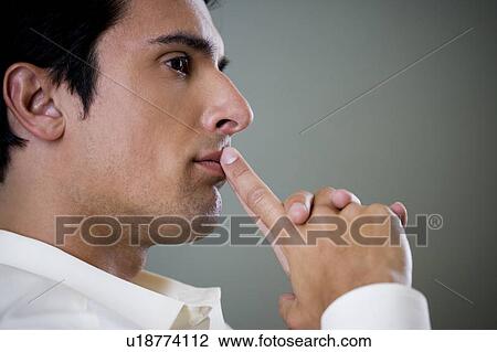 Portrait of a man looking thoughtful and pensive View Large Photo Image Stock Image - Portrait of a man looking thoughtful and pensive. Fotosearch
