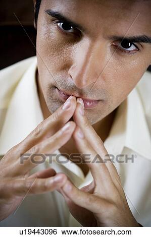 Portrait of a man looking thoughtful and pensive View Large Photo Image Stock Photograph - Portrait of a man looking thoughtful and pensive. Fotosearch