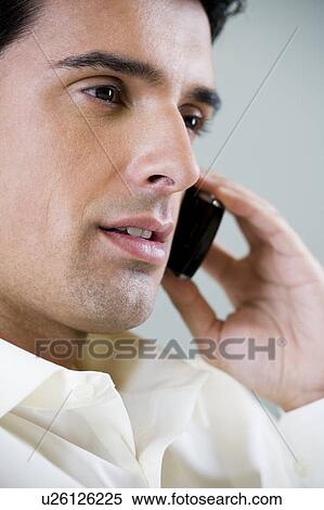 Portrait of a man using a cellphone View Large Photo Image Stock Photography - Portrait of a man using a cellphone. Fotosearch
