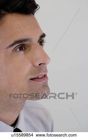 Picture - Side profile portrait of a businessman looking happy . Fotosearch