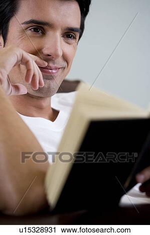 Stock Image - Portrait of a man reading. Fotosearch