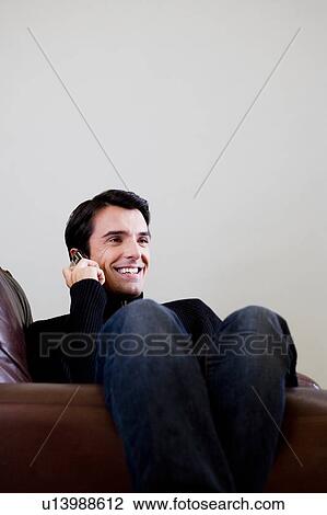 Portrait of a man using a mobile phone View Large Photo Image Stock Image - Portrait of a man using a mobile phone. Fotosearch