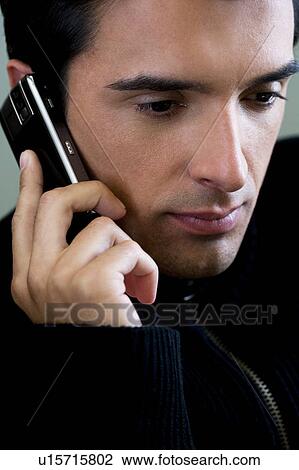 Portrait of a man using a mobile phone View Large Photo Image Stock Image - Portrait of a man using a mobile phone. Fotosearch