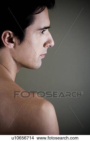 Portrait of a young man looking pensive View Large Photo Image Picture - Portrait of a young man looking pensive. Fotosearch