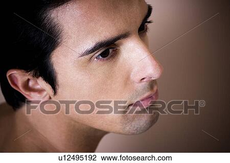 Portrait of a young man looking pensive View Large Photo Image Stock Image - Portrait of a young man looking pensive. Fotosearch
