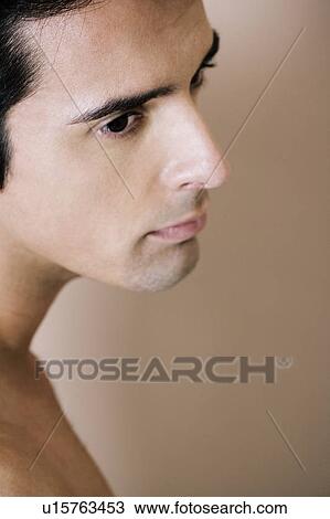 Portrait of a young man looking pensive View Large Photo Image Stock Image - Portrait of a young man looking pensive. Fotosearch