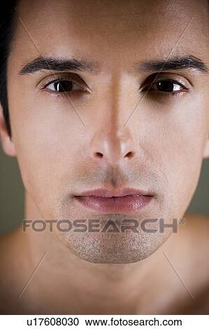Portrait of a young man looking pensive View Large Photo Image Stock Image - Portrait of a young man looking pensive. Fotosearch
