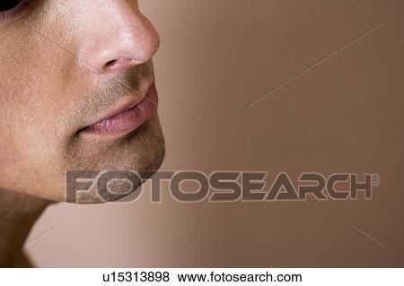 Portrait of a young man looking pensive View Large Photo Image Stock Photo - Portrait of a young man looking pensive. Fotosearch