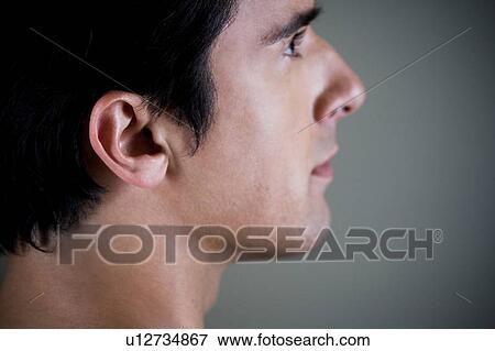 Stock Photo - Portrait of a young man, side profile, . Fotosearch