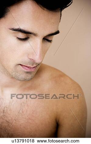 Portrait of a young man with his eyes closed View Large Photo Image Stock Photo - Portrait of a young man with his eyes closed. Fotosearch