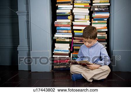 little boy reading on the floor View Large Photo Image Stock Image - little boy reading on the floor. Fotosearch