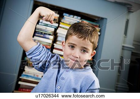 little boy showing off his muscles View Large Photo Image Picture - little boy showing off his muscles. Fotosearch